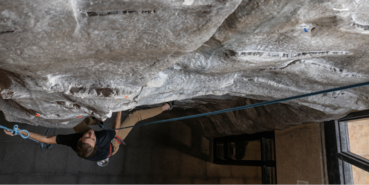 Climber on climbing wall.