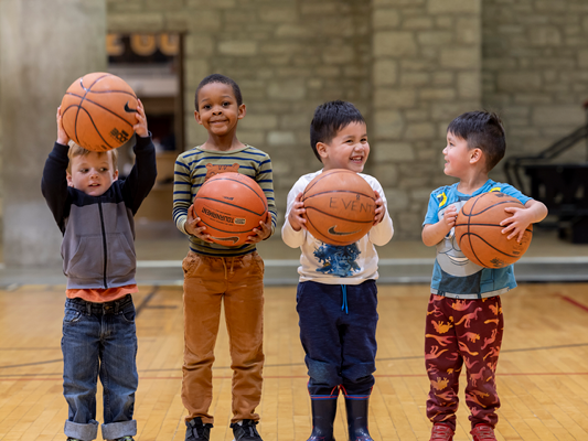 Children playing on basketball court at MizzouRec