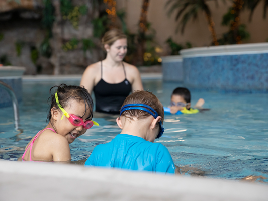 Kids playing in pool.