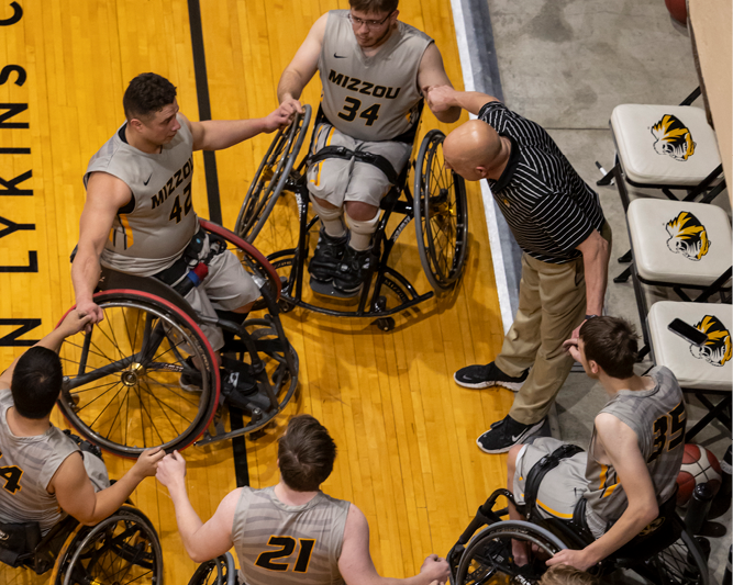 Mizzou Wheelchair Basketball playing against another team.