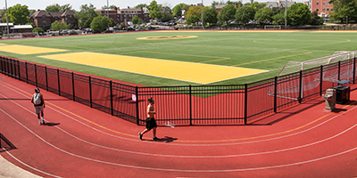 Students running on Stankowski Field.