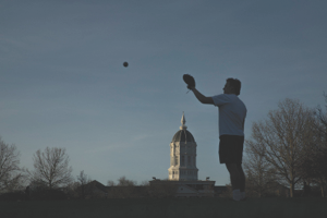 Student playing baseball