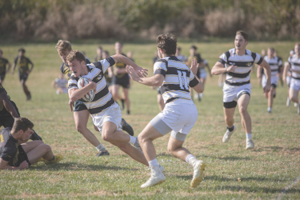 Men playing rugby