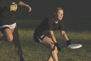 Woman playing ultimate frisbee