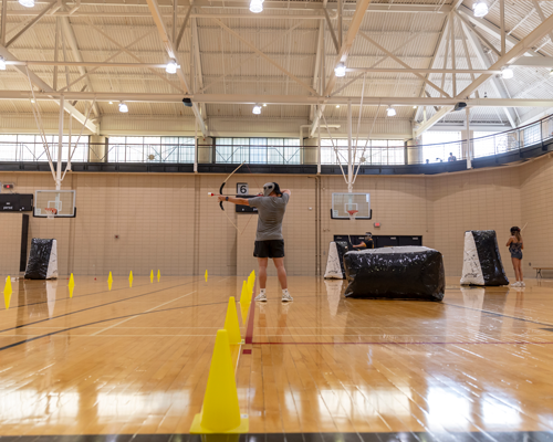 Girl playing archery.