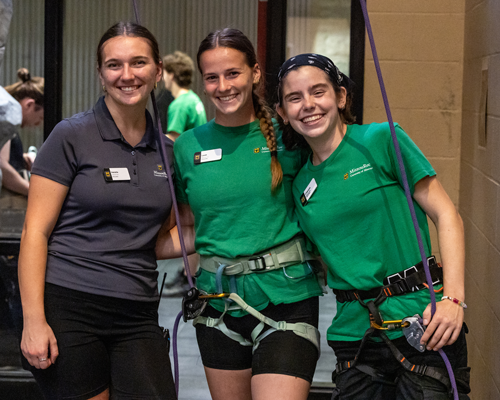 Students wearing harnesses.
